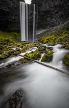 Waterfall cascading over rocky outcrop