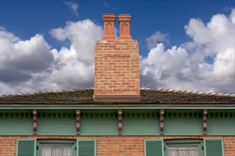 Classic home facade with a dual chimney