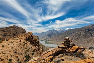 View of Spiti valley in Himalayas with stone cairn. Spiti valley