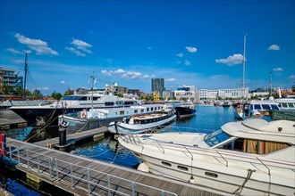 Yachts and boats moored in Willemdock in Antwerp