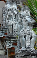 Several historical statues of Hindu deities Hindu god Brahma with four heads at stairway to Hindu temple
