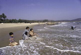 Children playing in Rishikonda beach in Visakhapatnam