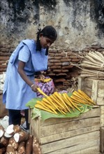 School girl purchasing Palmyra Tuber at Tirunelveli