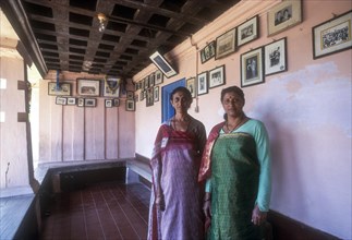Kodava Women standing in her traditional home in Kodagu
