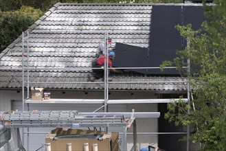 Installation of photovoltaic panels on a garage roof