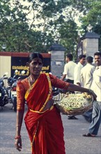 A Woman selling flowers near VOC Park at Coimbatore