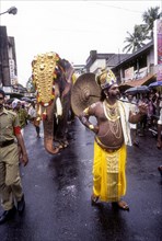 Mahabali in Athachamayam celebration procession in Tripunithua during raining