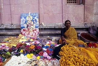 Woman selling religious offerings in Palani temple premises