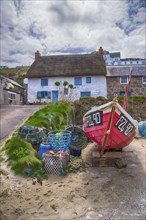 Fishing boat and houses in coastal village