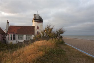 Tower mill converted to residential accommodation on shingle beach