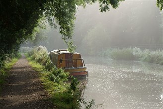 Towpath and a narrow boat moored on the bank of the Kennet &amp