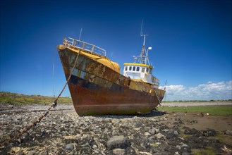 Stranded and derelict fishing trawler