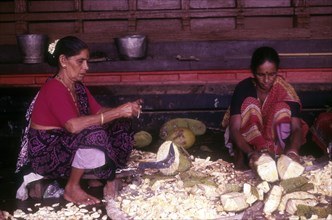 Women cutting raw jackfruit to make side dish of lunch at Madhur Sri Anantheshwara Vinayaka temple