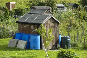 Sheds with rainwater butts on allotments