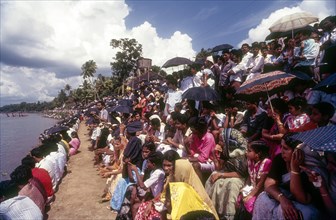 Boat racing spectators seated on the banks of Pamba river in Aranmula