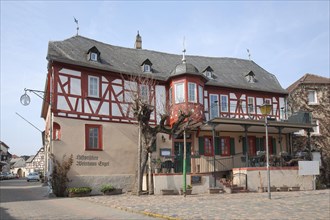 Historic half-timbered house Weinhaus zum Engel on the market square in Kiedrich
