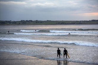 Surfing at Strandhill beach off the west coast of Ireland on Wild Atlantic Way. Sligo
