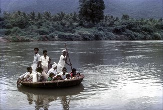 People enjoying Coracle Ride in River Bhavani at Nellithurai near Mettupalayam