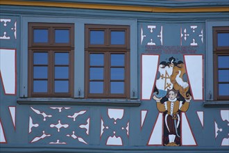 Detail as a wood carving of the half-timbered house on the market square