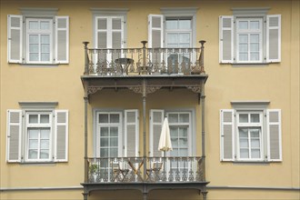 House wall with balcony and shutters on a villa built in 1857 Zum Quellenpark in Bad Soden