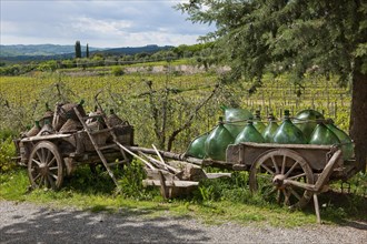Wooden cart with wine bottles