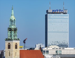 Church tower of St. Mary's Church with the Park Inn Hotel am Alexanderplatz