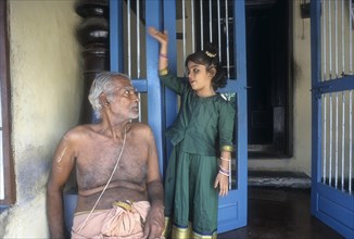 Palghat brahmin grandfather and granddaughter at Kalpathy near Palakkad