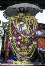 Lord Kumbeswarar with Goddess Mangalambigai in decorated Rishaba Vahanam places on the bank of the Mahamakham tank in Kumbakonam