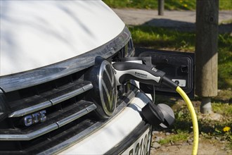 Vehicle filling up with electricity at a charging station
