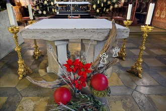 Main altar with floral decorations and candles
