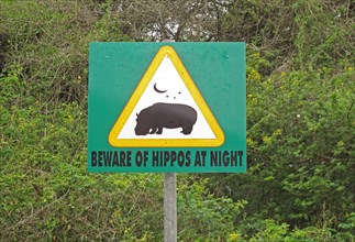 Warning sign Beware of Hippos at Night