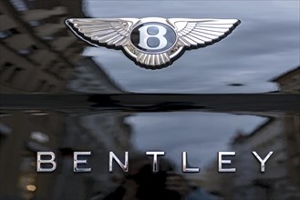 Logo and lettering of the Bentley car brand on a Bentley Flying Spur luxury saloon