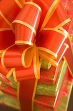 Colored gift boxes with red and golden bow