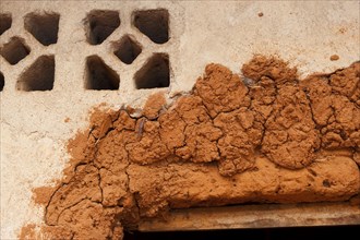 Mud repairs to the door frame of a house