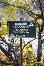 Warning sign against crocodiles