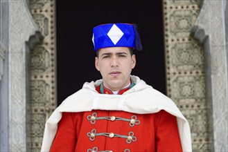 Guard in traditional uniform in front of the gate Mausoleum Mohammed V and Hassan II