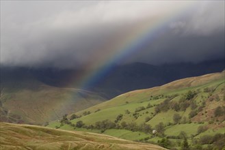 Rainbow forming over the Highlands during a rainstorm