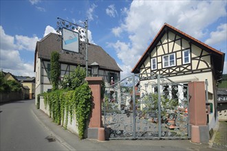 Winery Speicher-Schuth with signboard and gate as wrought-iron work in Kiedrich