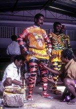 Painted human bodies for Pulikali Tiger Dance