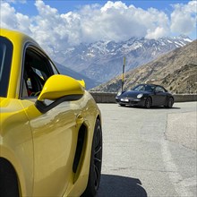 Porsche sports car on the left GT4 in the background 911 on Jaufenpass