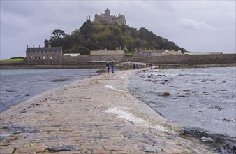 Sea water covering the man-made causeway to the tidal island