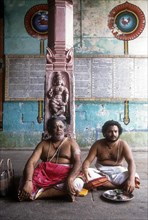 Priests sitting in the corridor of Vaitheeswaran Temple