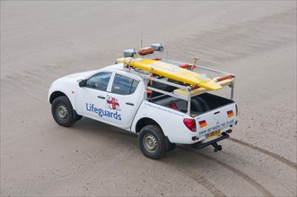 RNLI Lifeguard vehicle and equipment on beach