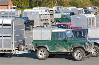 Land Rover and various other 4x4 vehicles and livestock trailers at livestock market