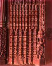 Richly carved wooden door of an old house portal in kanadukathan
