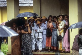 School children Waiting during rainingm