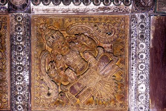 Wood carvings on the ceiling in thousand years old Avittathur Siva temple near Thrissur or Trichur