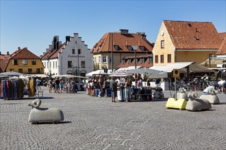 Weekly market with tourists in the pedestrian zone
