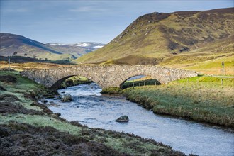 View of the stone bridge over the river in Glen