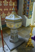 Baptismal font with candle